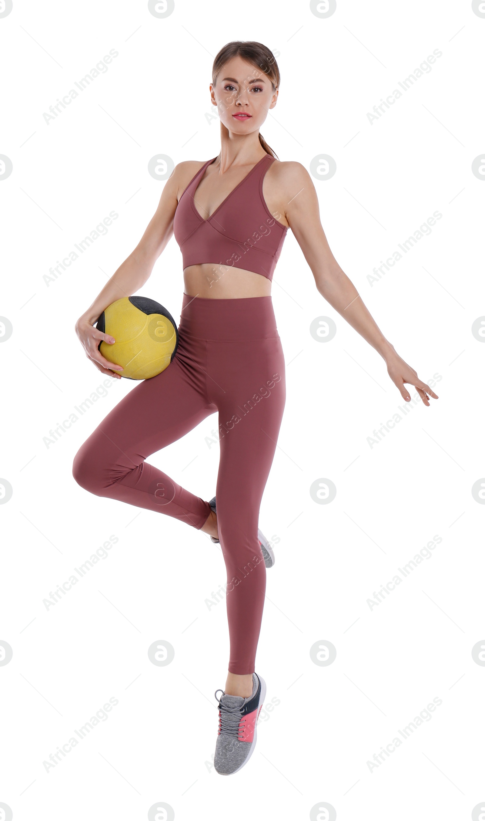 Photo of Athletic woman with medicine ball isolated on white