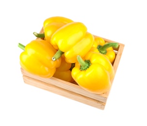 Photo of Crate of ripe yellow bell peppers isolated on white