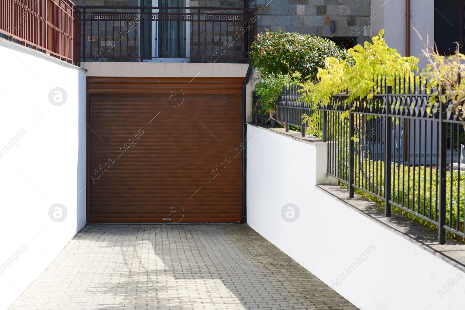 Photo of Building with roller shutter garage door outdoors