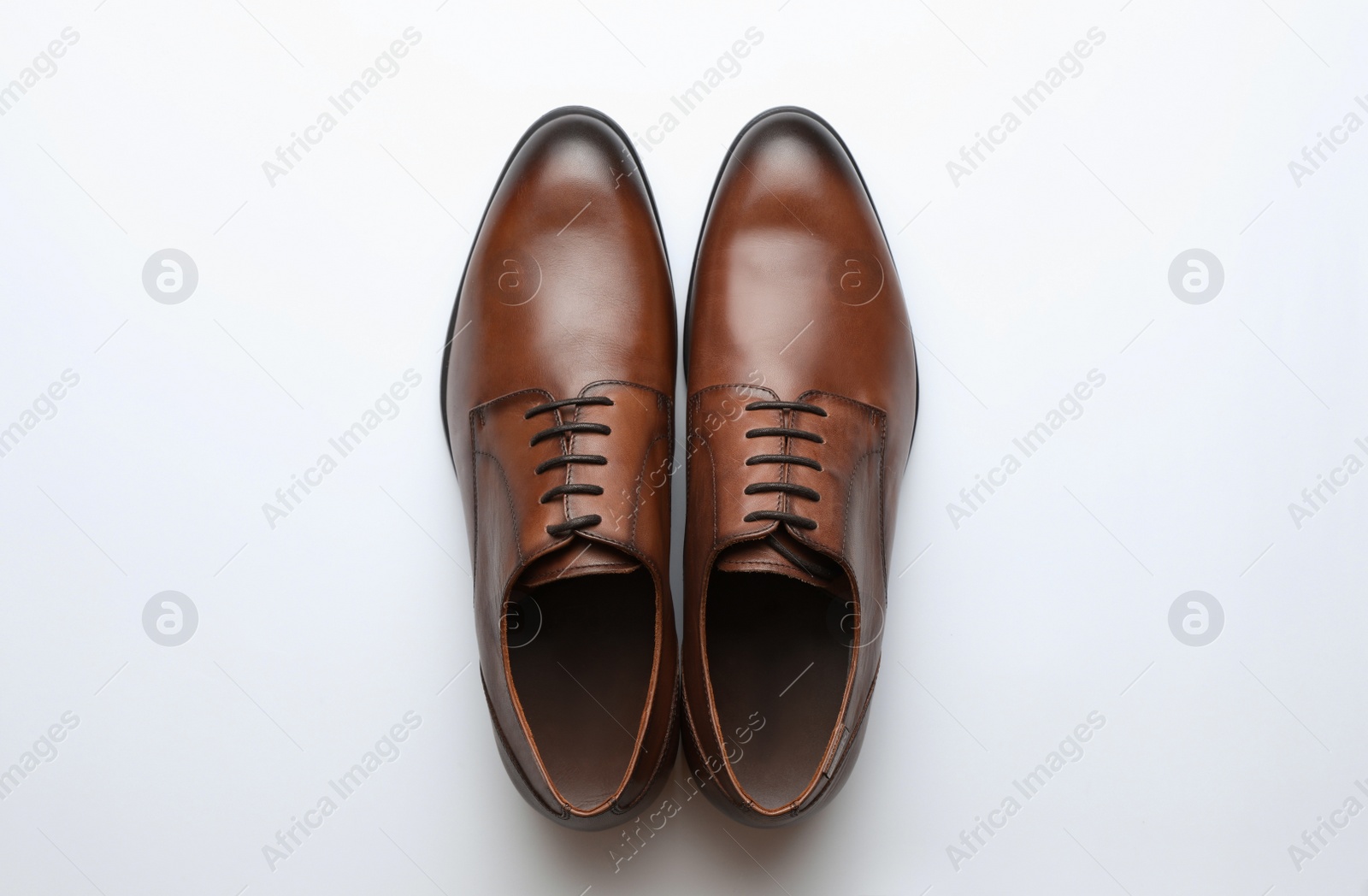 Photo of Wedding shoes on white background, top view