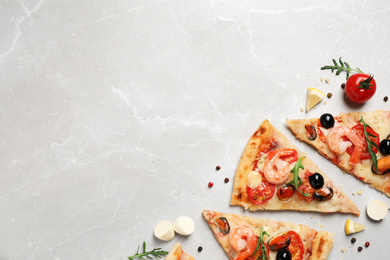 Photo of Tasty pizza with seafood and ingredients on light grey marble table, flat lay. Space for text