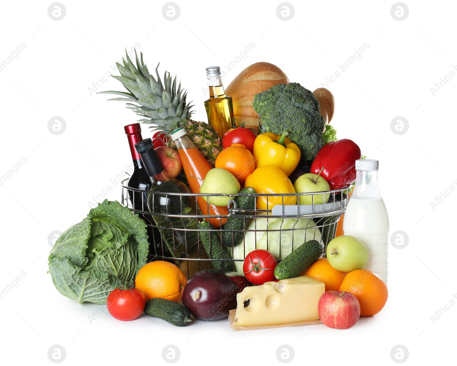 Photo of Shopping basket and grocery products on white background