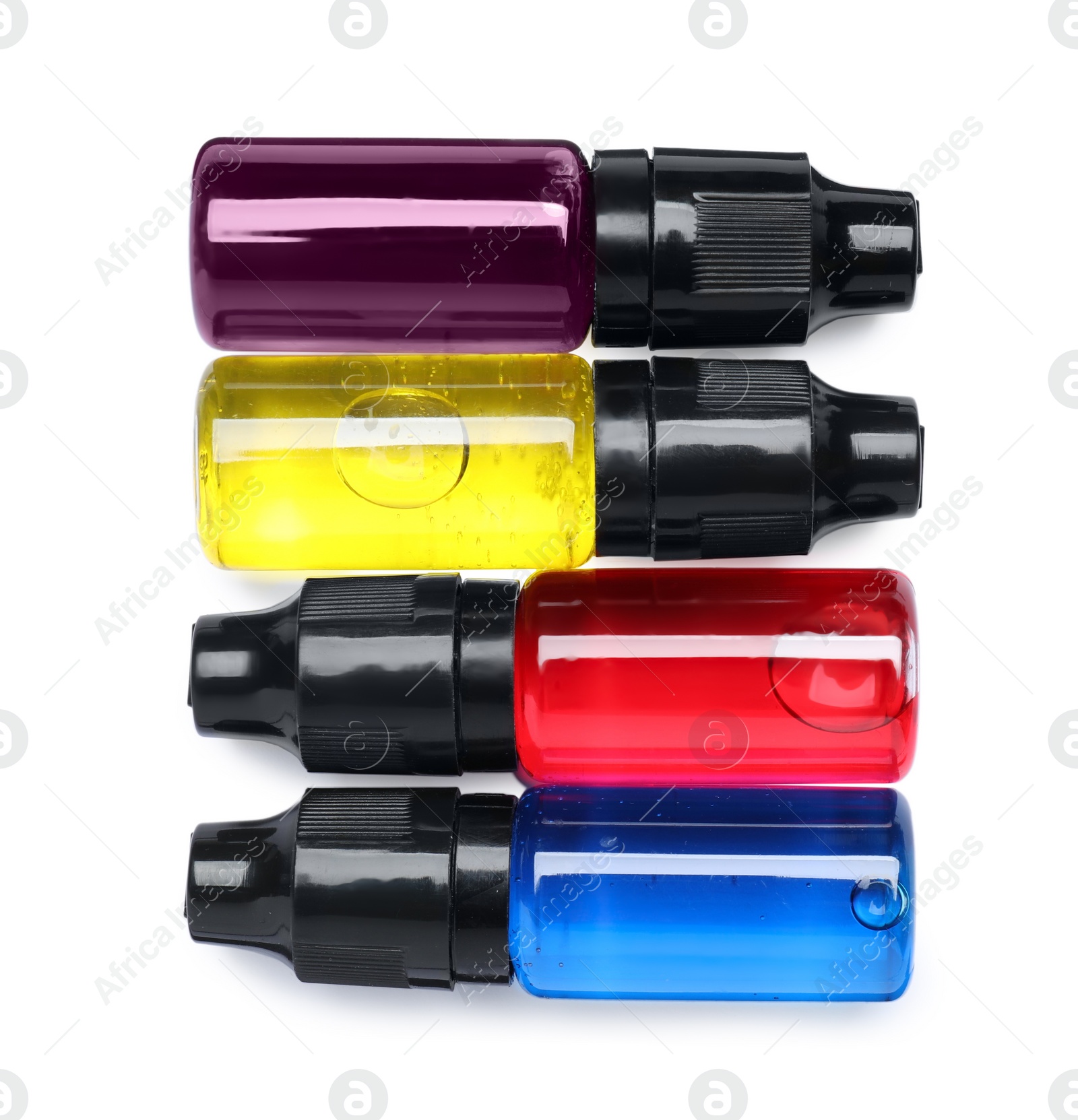 Photo of Bottles with different food coloring on white background, top view