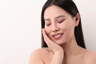 Portrait of beautiful woman on white background