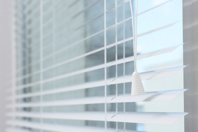 Photo of Window with horizontal blinds indoors, closeup. Space for text