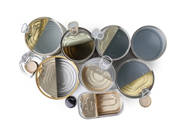 Photo of Many open tin cans isolated on white, top view