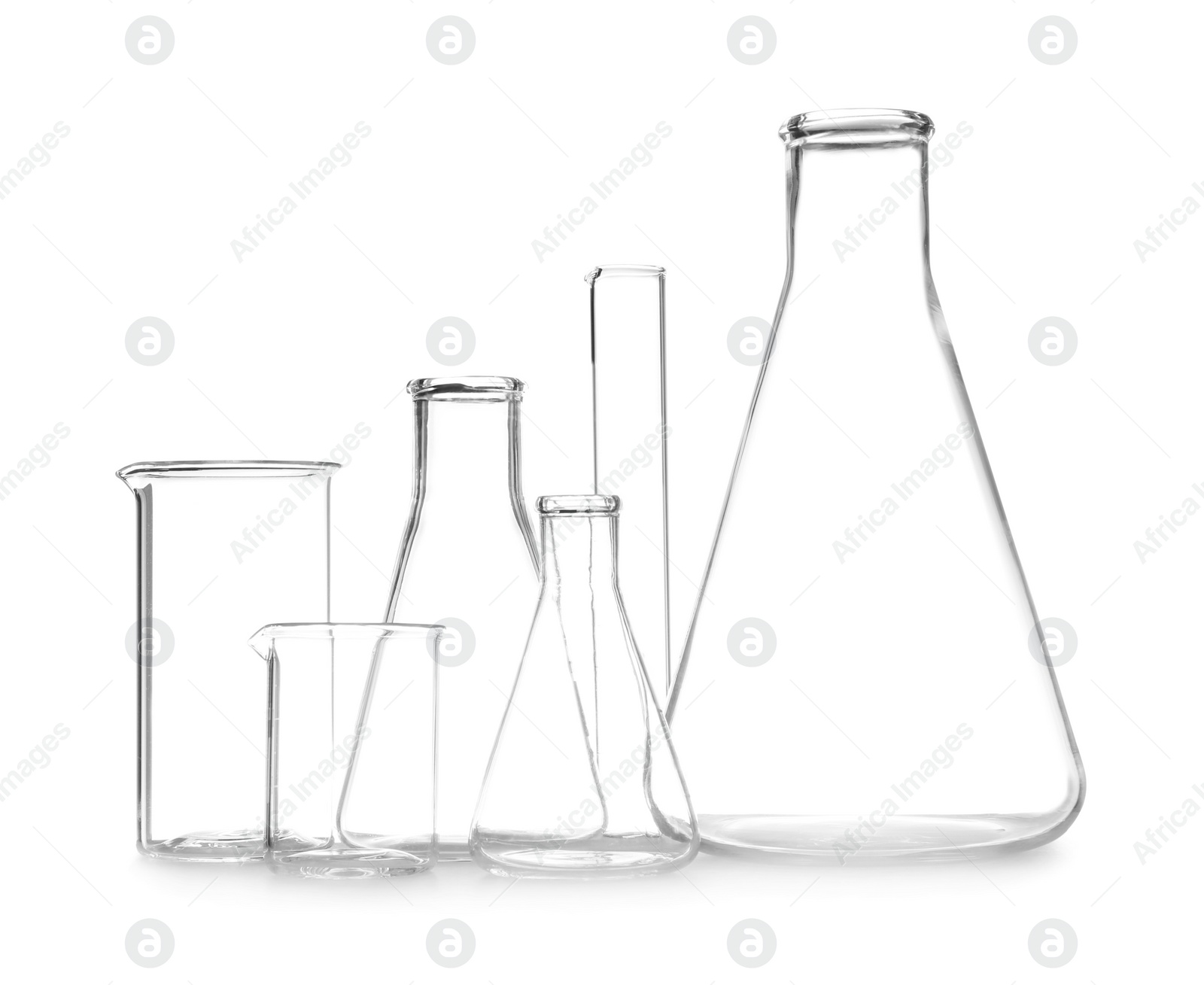 Photo of Clean empty laboratory glassware isolated on white