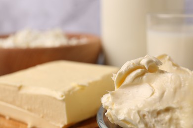 Photo of Tasty homemade butter and dairy products on table, closeup