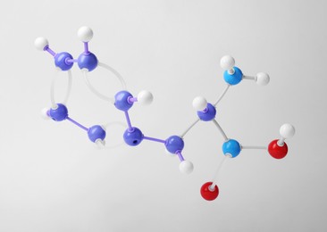 Photo of Molecule of phenylalanine on white background. Chemical model