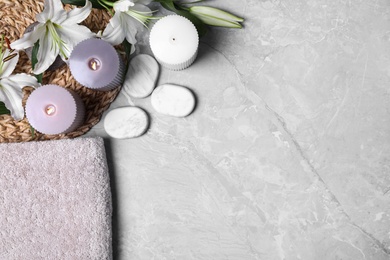 Photo of Flat lay composition with spa accessories and space for text on grey marble background