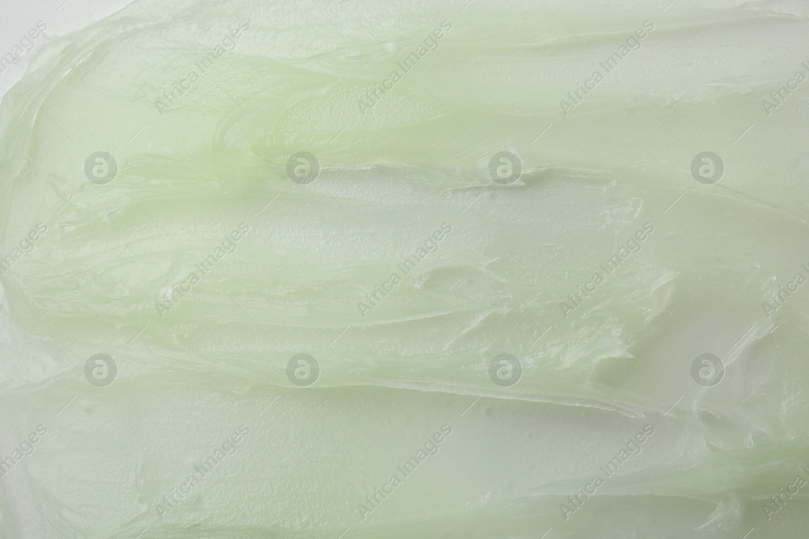 Photo of Texture of cosmetic petrolatum as background, closeup view