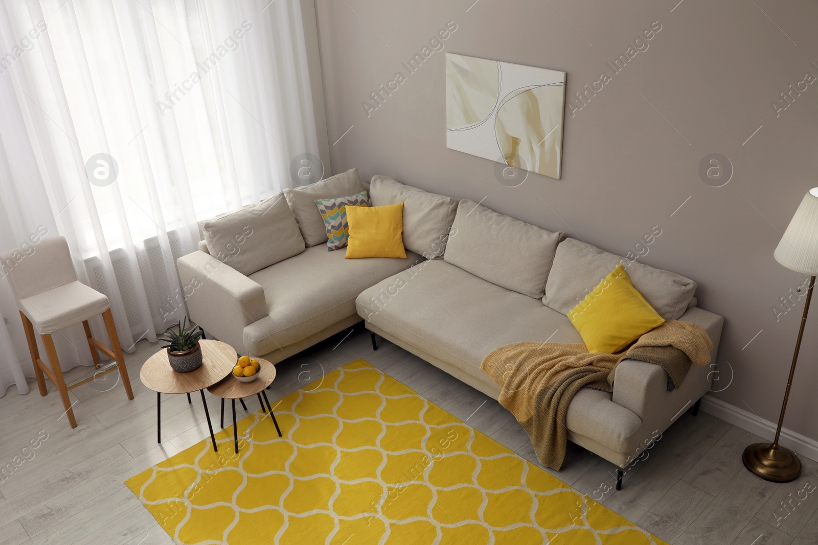 Photo of Living room interior with stylish rug and furniture, above view