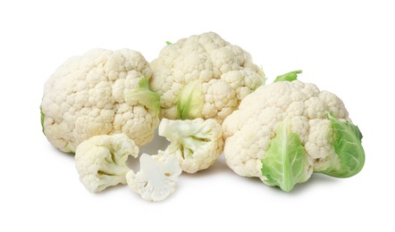 Cut and whole cauliflowers on white background
