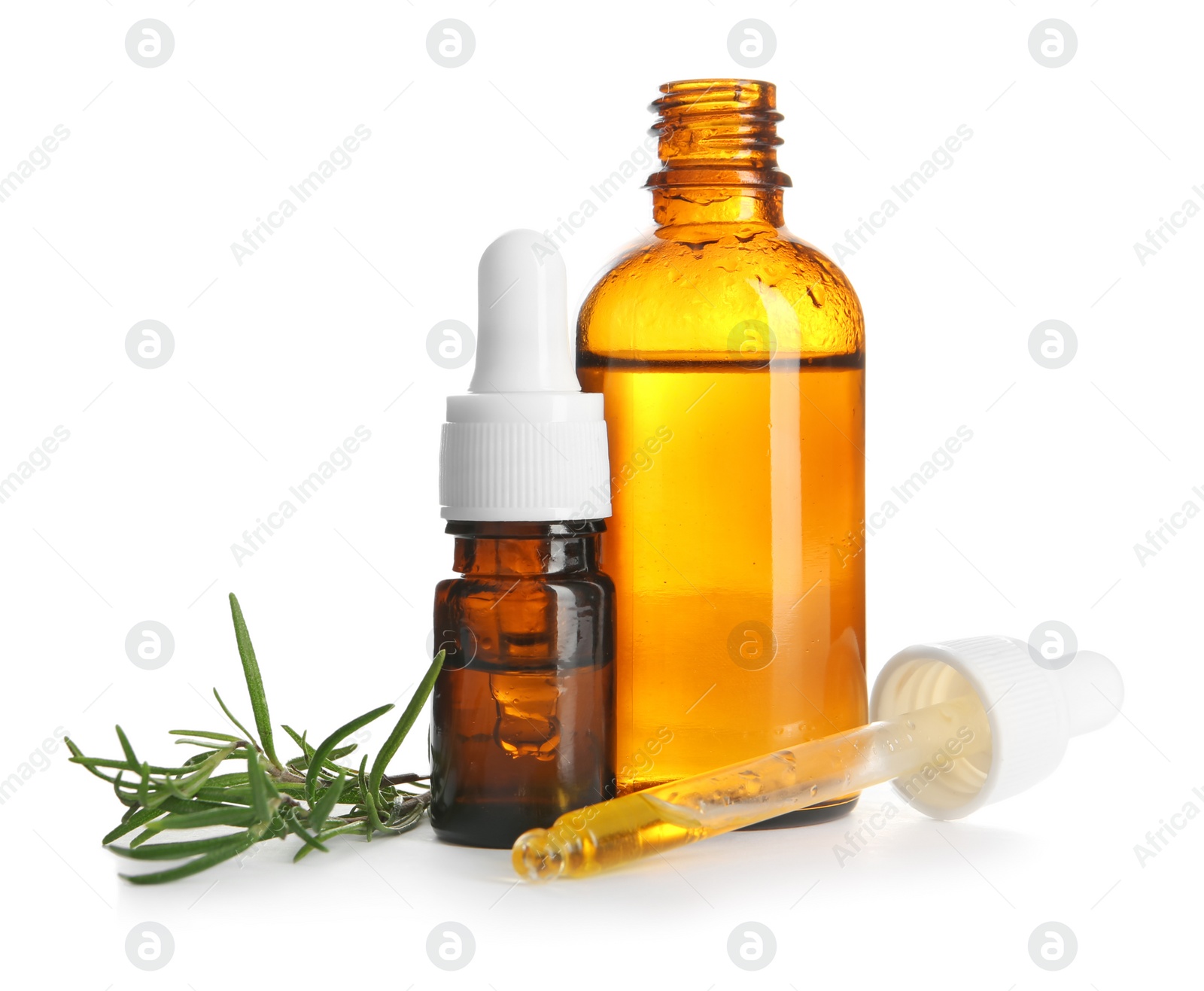 Photo of Different bottles with rosemary oil and fresh twig on white background