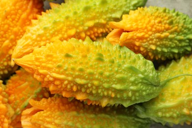 Photo of Many fresh bitter melons as background, closeup