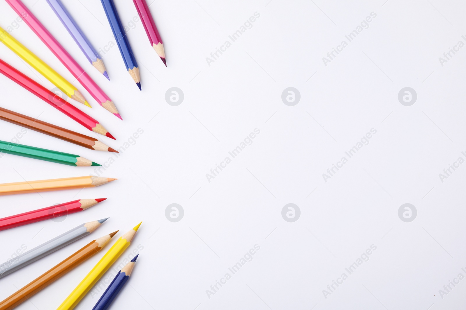 Photo of Colorful wooden pencils on white background, flat lay. Space for text