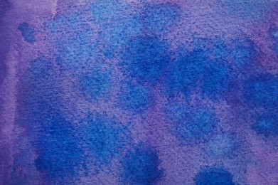 Photo of Abstract watercolor painting with blue blots as background, top view