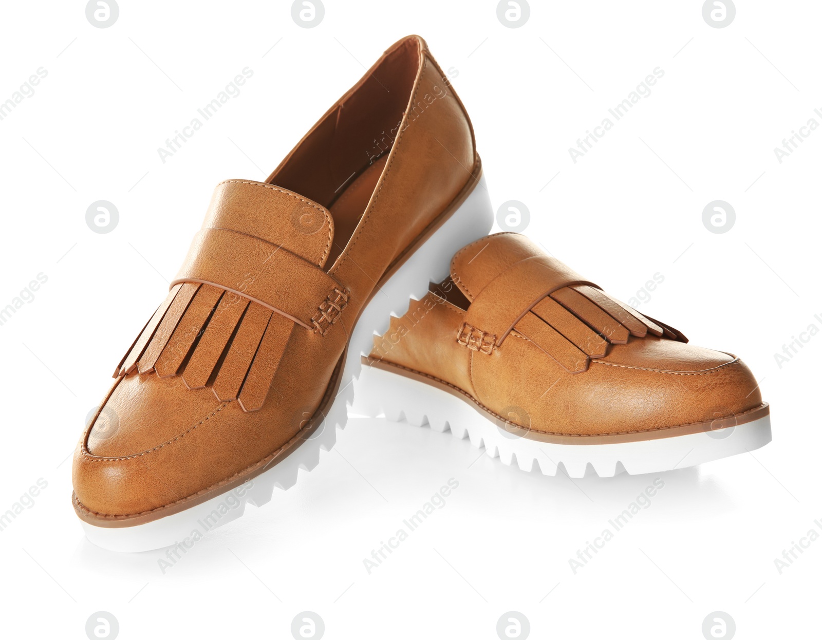 Photo of Pair of female shoes on white background