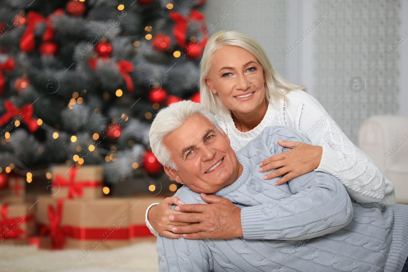 Photo of Happy mature couple at home. Christmas celebration