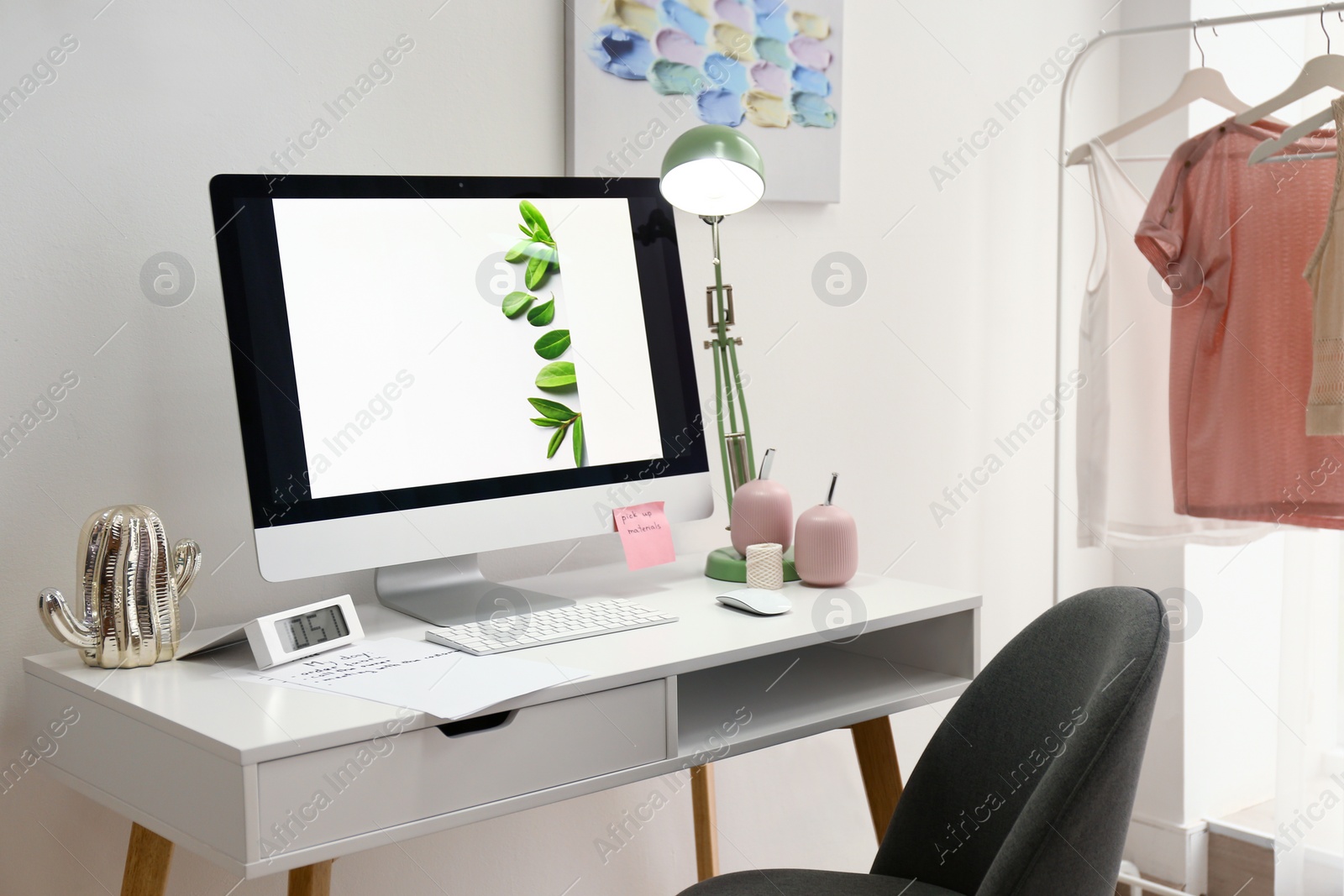Photo of Designer's workplace with modern computer on table