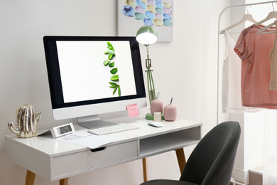 Photo of Designer's workplace with modern computer on table