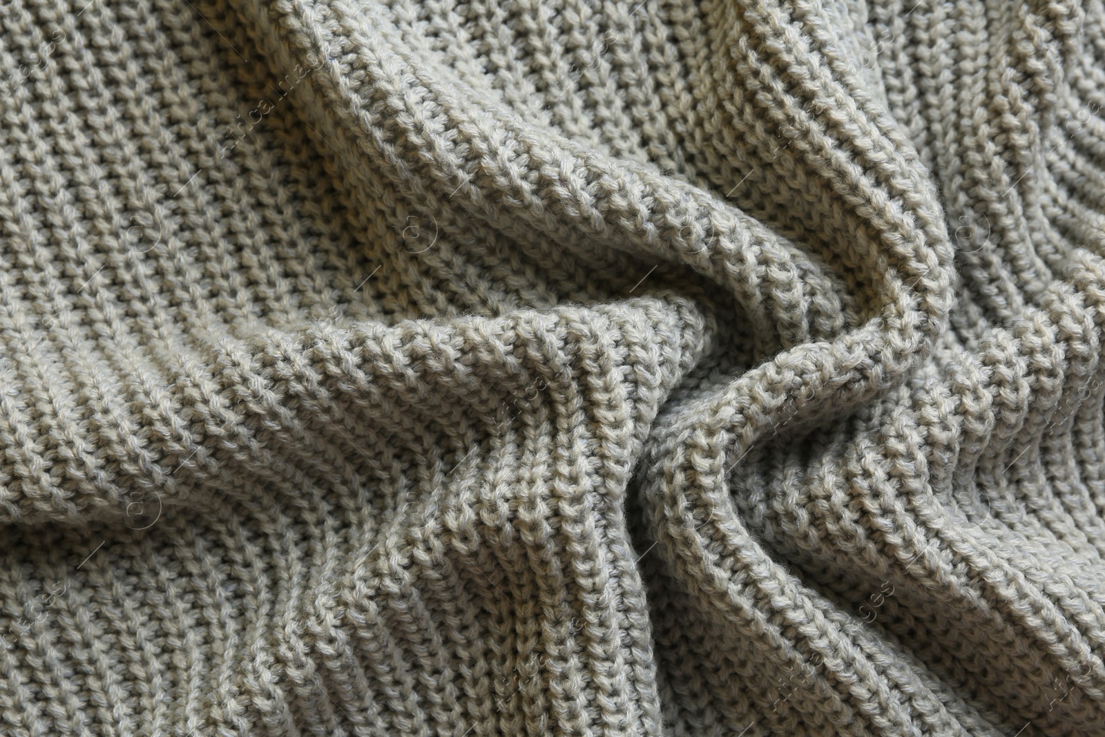 Photo of Beautiful grey knitted fabric as background, top view