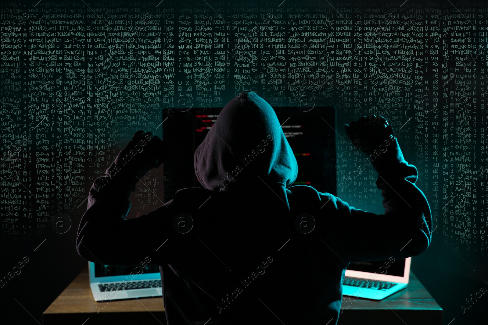 Image of Hacker near computers in dark room and digital symbols on background. Cyber crime concept