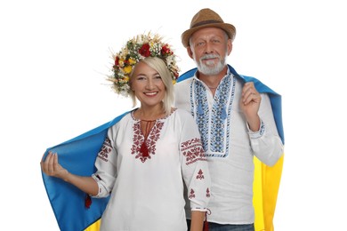 Photo of Happy mature couple with national flag of Ukraine on white background