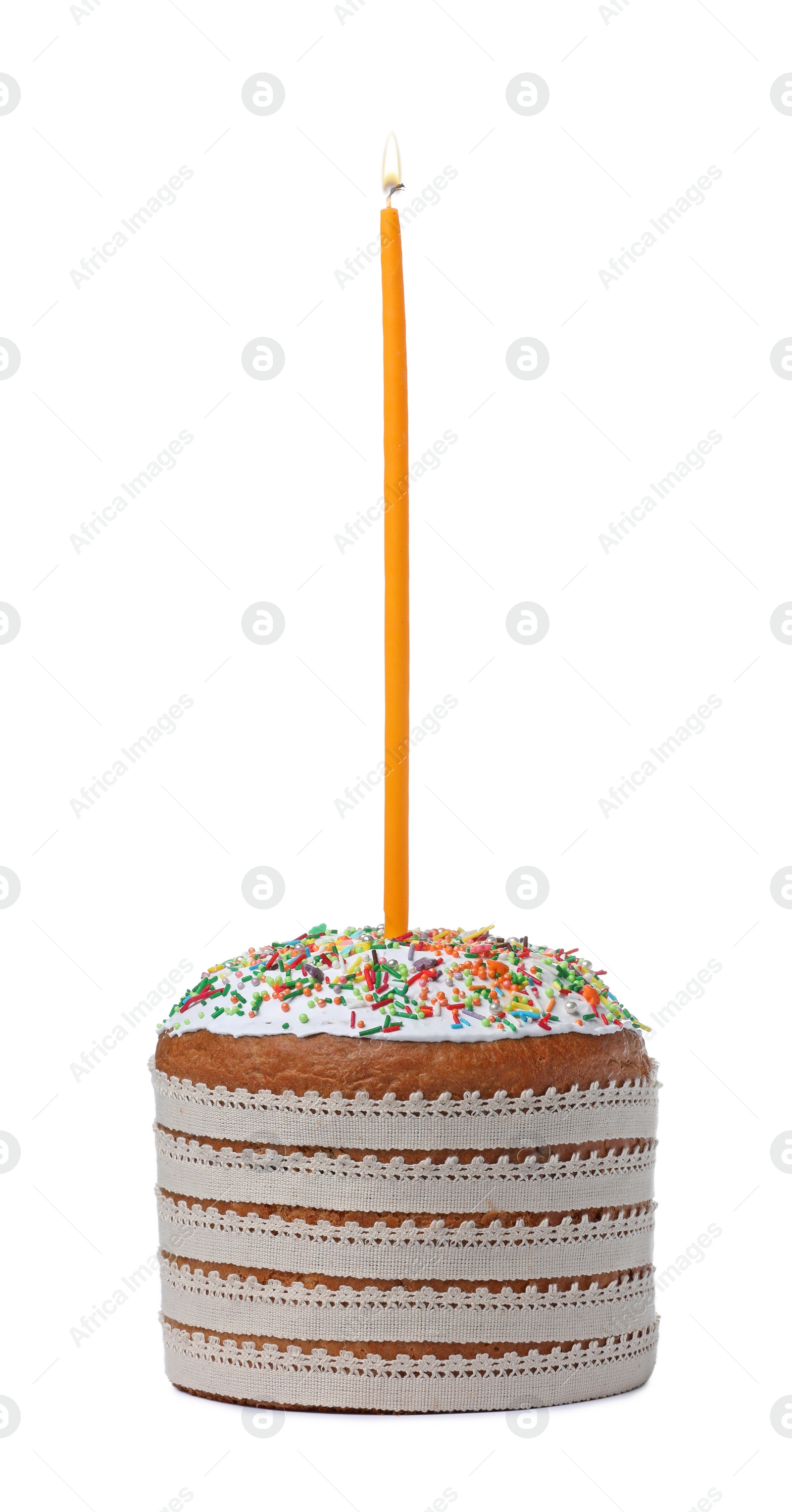 Photo of Traditional Easter cakes with sprinkles and candle on white background