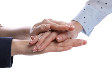 Women holding hands together on white background, closeup