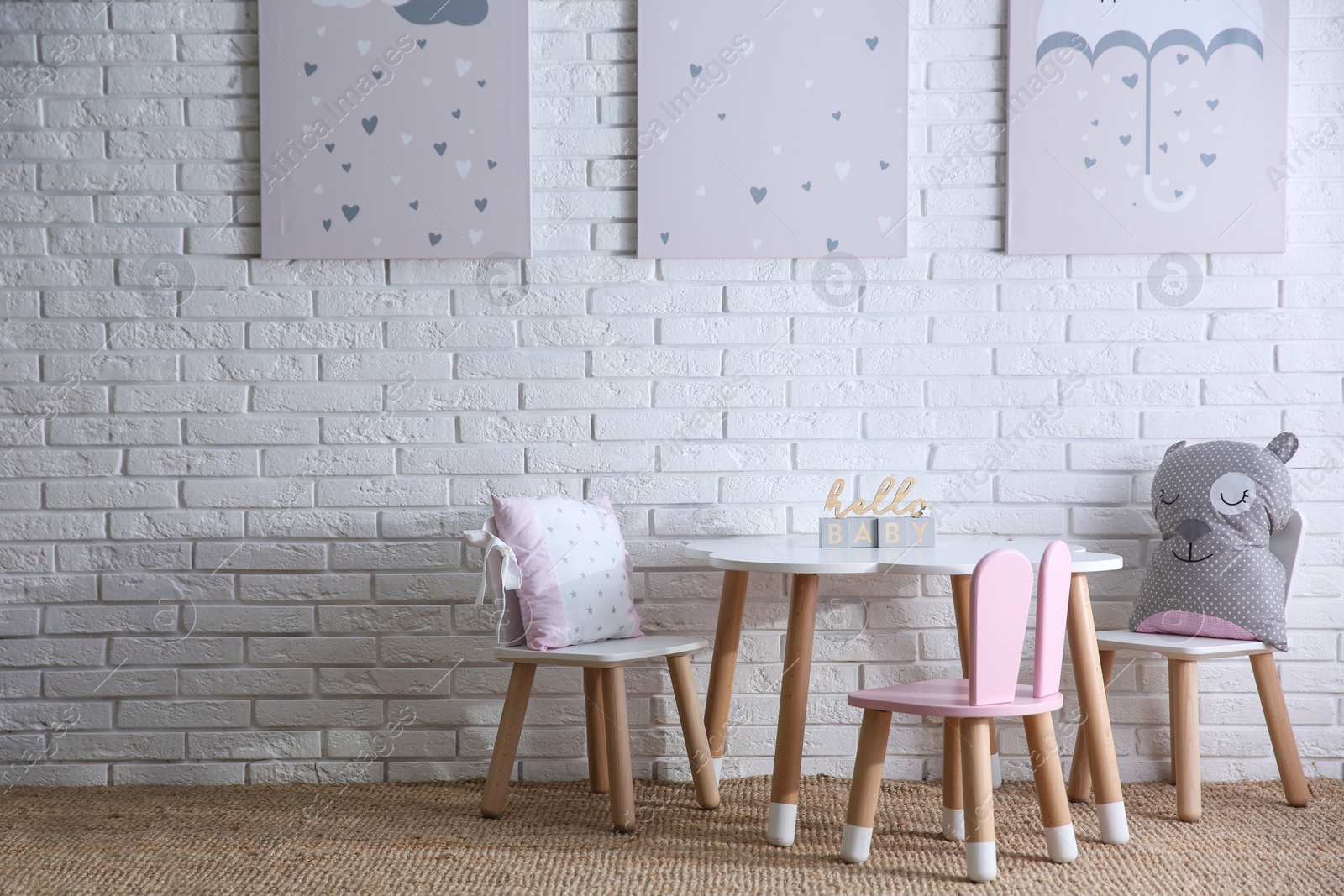 Photo of Baby room interior with toys and stylish furniture