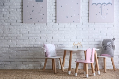 Baby room interior with toys and stylish furniture