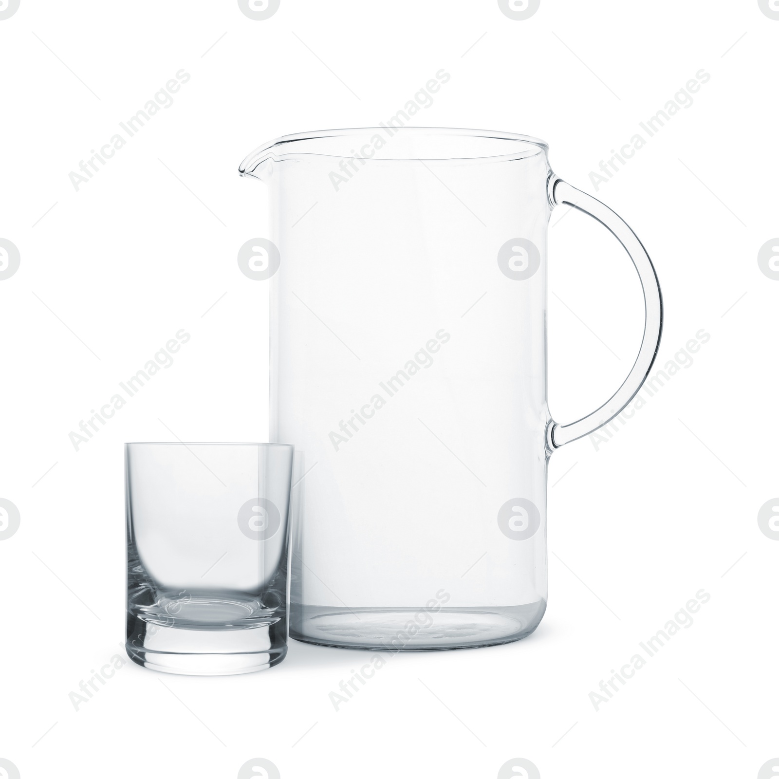 Image of Empty glass and jug isolated on white