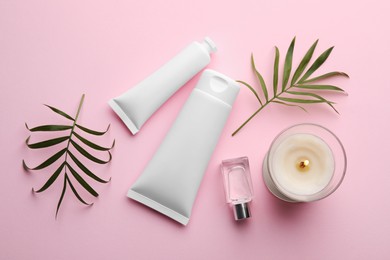 Photo of Flat lay composition with different hand care cosmetic products on pink background