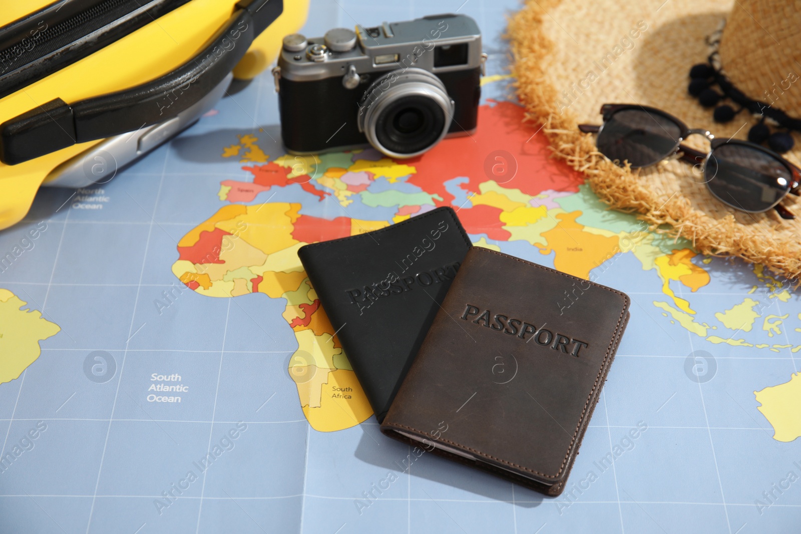 Photo of Passports and tourist items on world map. Travel agency