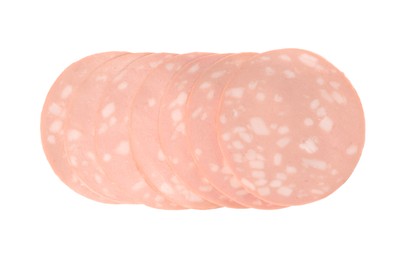 Photo of Slices of delicious boiled sausage on white background, top view