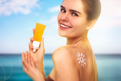 Image of Sun protection. Beautiful young woman with tube of sunblock on beach, closeup
