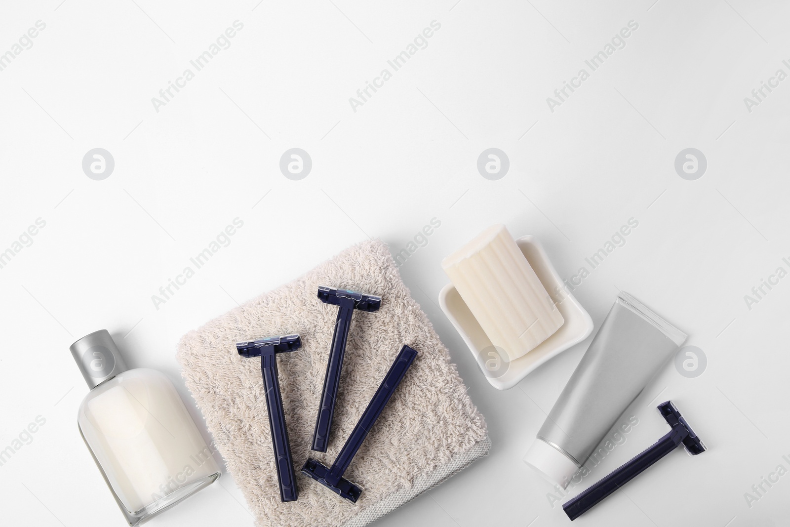 Photo of Different men's shaving accessories on white background, flat lay. Space for text