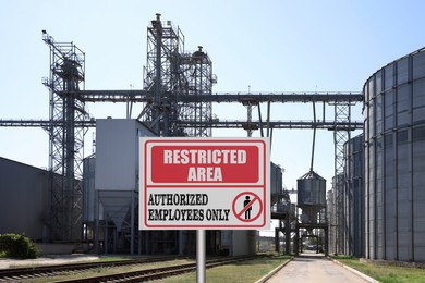 Image of Sign with text Restricted Area Authorized Employees Only near granaries outdoors
