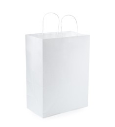 Photo of Empty shopping paper bag isolated on white