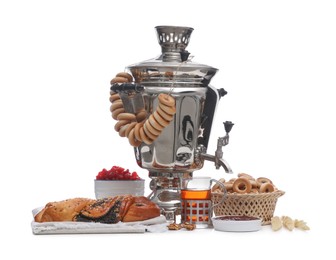 Photo of Traditional Russian samovar and treats on white background