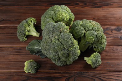 Fresh raw broccoli on wooden table, above view