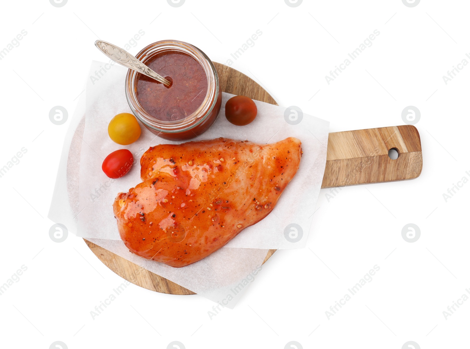 Photo of Fresh marinade and raw chicken fillets isolated on white, top view