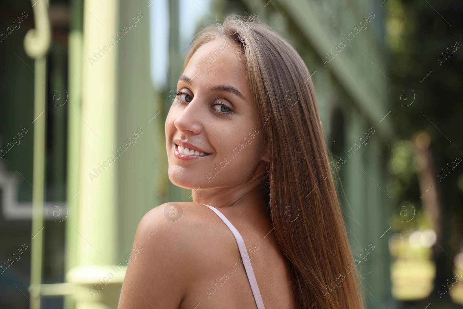 Photo of Beautiful young woman in stylish outfit outdoors