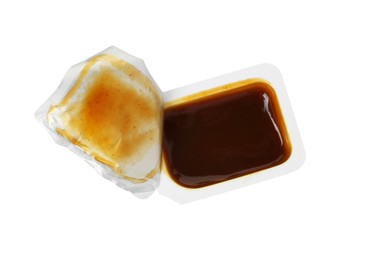 Tasty barbecue sauce in plastic container isolated on white, top view