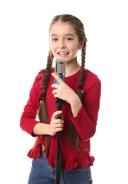 Photo of Cute girl with microphone on white background