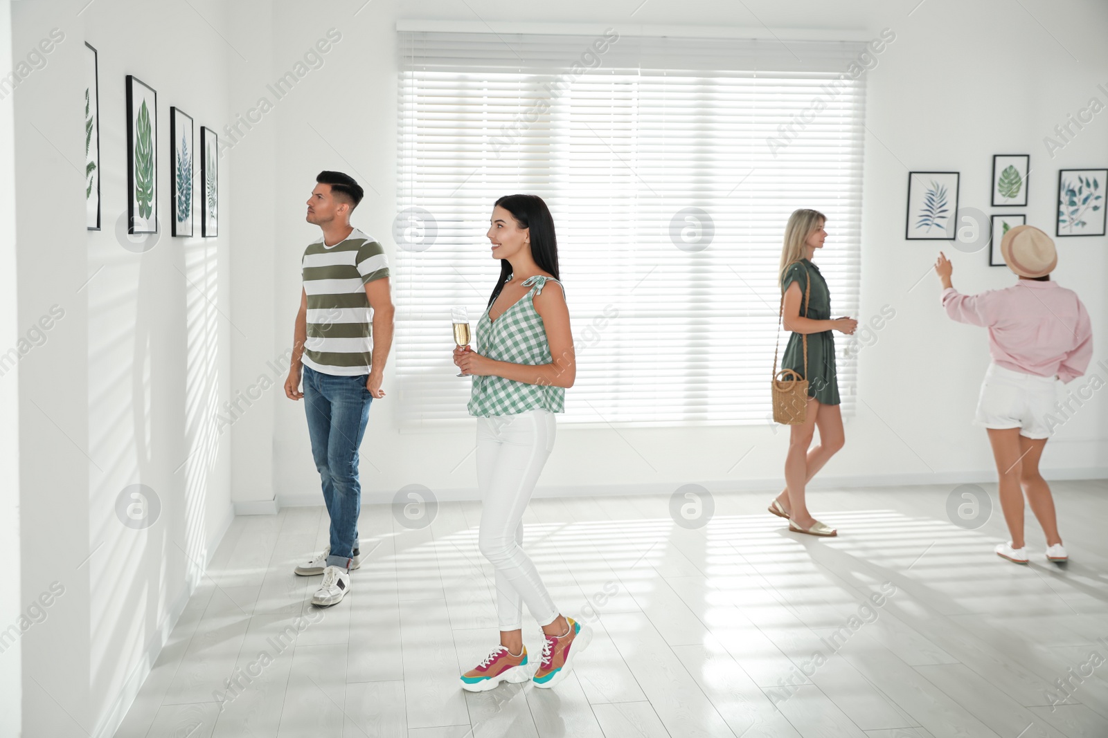 Photo of Group of people at exhibition in art gallery