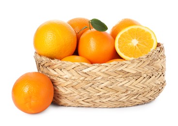 Fresh oranges in wicker basket isolated on white
