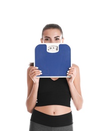 Photo of Happy young woman with scales on white background. Weight loss motivation