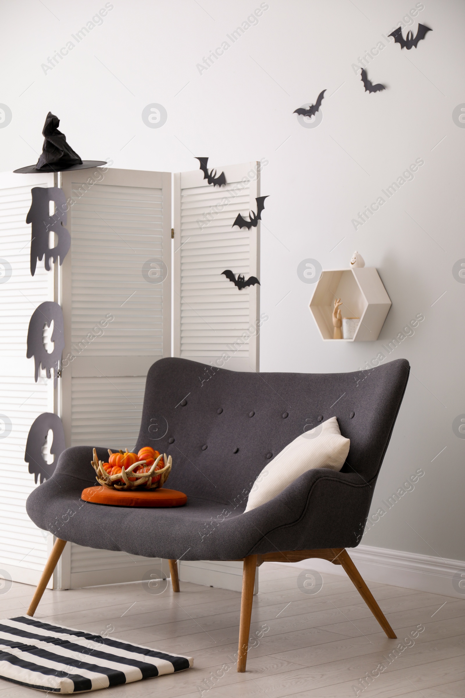 Photo of Stylish room interior with creative Halloween decor